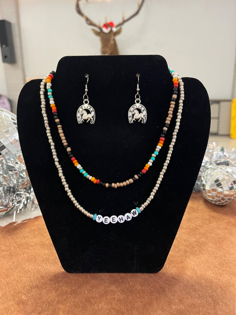 Silver yeehaw necklace